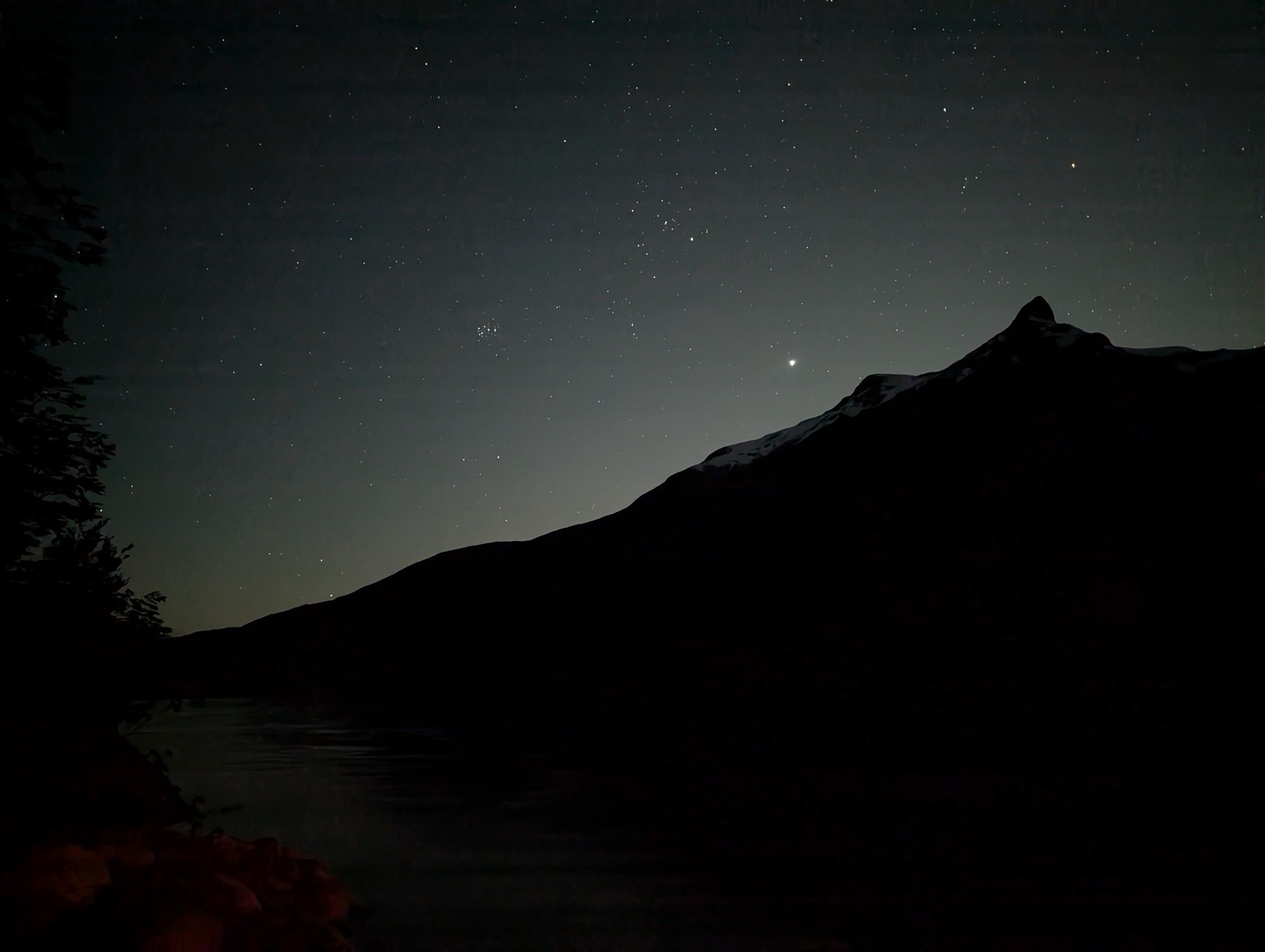 Stars above the mountains and Lago Espolón at night
